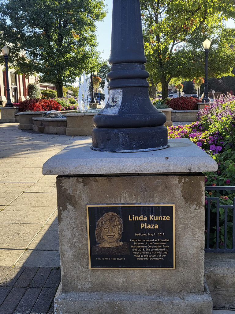 A plaque commemorates Linda Kunze Plaza outside the
 Main Street Train Station.