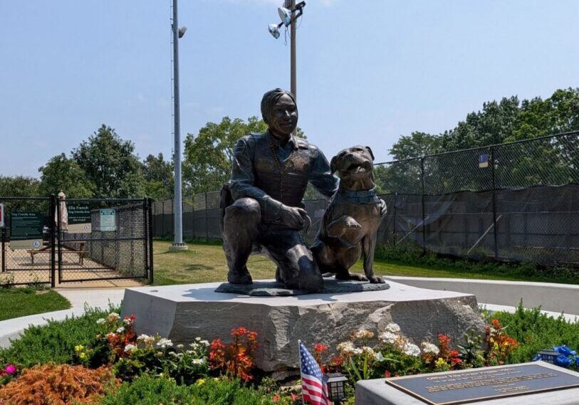 A bronze statue of Officer Ella French and her dog, Bella, was dedicated in Wentworth Park in 2025.